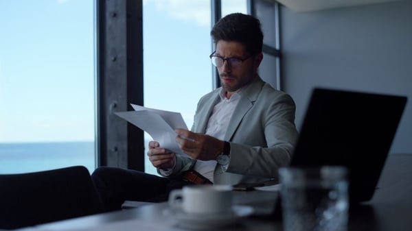 Investor reviewing research materials